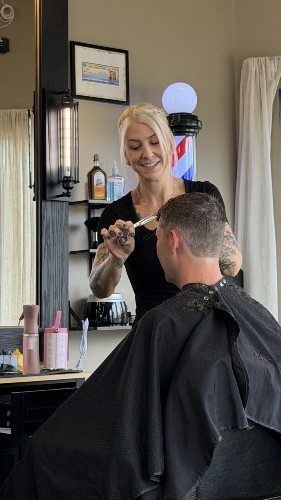 Maren Rosario, barber at May's Barbershop
